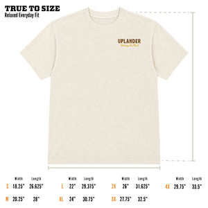 Size guide for the Bobwhite Quail t-shirt showing an off-white relaxed fit tee with 'Uplander — Chasing the Flush' chest graphic, labeled 'True to Size — Relaxed Everyday Fit,' with width and length measurements for sizes S through 4X.