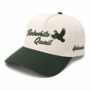 Ivory and dark green two-tone snapback hat with an embroidered flying bobwhite quail and 'Bobwhite Quail' script on the front, 'Uplander' embroidered on the side.