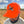 Man wearing a blaze orange snapback hat with orange mesh back featuring an embroidered flying rooster pheasant on the front, and 'Uplander' script on the side, worn outdoors.