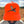 Close-up view of a man wearing a blaze orange snapback hat featuring an embroidered flying rooster pheasant on the front, worn outdoors.