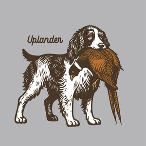 Illustration of an English Springer Spaniel holding a ring-necked pheasant in its mouth with Uplander branding on a grey background.