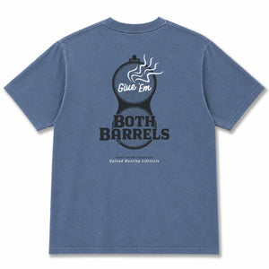 A blue crewneck t-shirt shown from the back, featuring a large graphic print of two barrels with steam and the text 'Give 'Em BOTH BARRELS' in black and white.