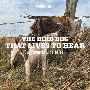 Brittany standing next to a ring-necked pheasant hanging on a barbed wire fence in a field, with text 'The Bird Dog That Lives to Hear, Our Favorite Line to Yell'.