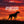 Silhouette of a German Shorthaired Pointer against a red sunset sky, with text 'The Best Part of the Hunt, It's Not the Flush'.