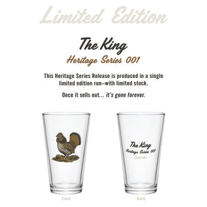 Front and back views of The King Heritage Series 001 limited edition pint glass, with a ruffed grouse illustration on the front and 'The King, Heritage Series 001, Uplander' text on the back, with text reading 'This Heritage Series Release is produced in a single limited edition run — Once it sells out... it's gone forever.'