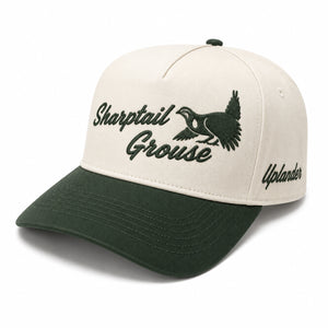 Ivory and dark green two-tone snapback hat with an embroidered sharptail grouse and 'Sharptail Grouse' script on the front, 'Uplander' embroidered on the side.