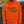 Man wearing a blaze orange heavyweight hoodie with 'Chasing the Flush' script graphic and 'Uplander' logo on the chest, with a kangaroo pocket and drawstring hood, worn outdoors.